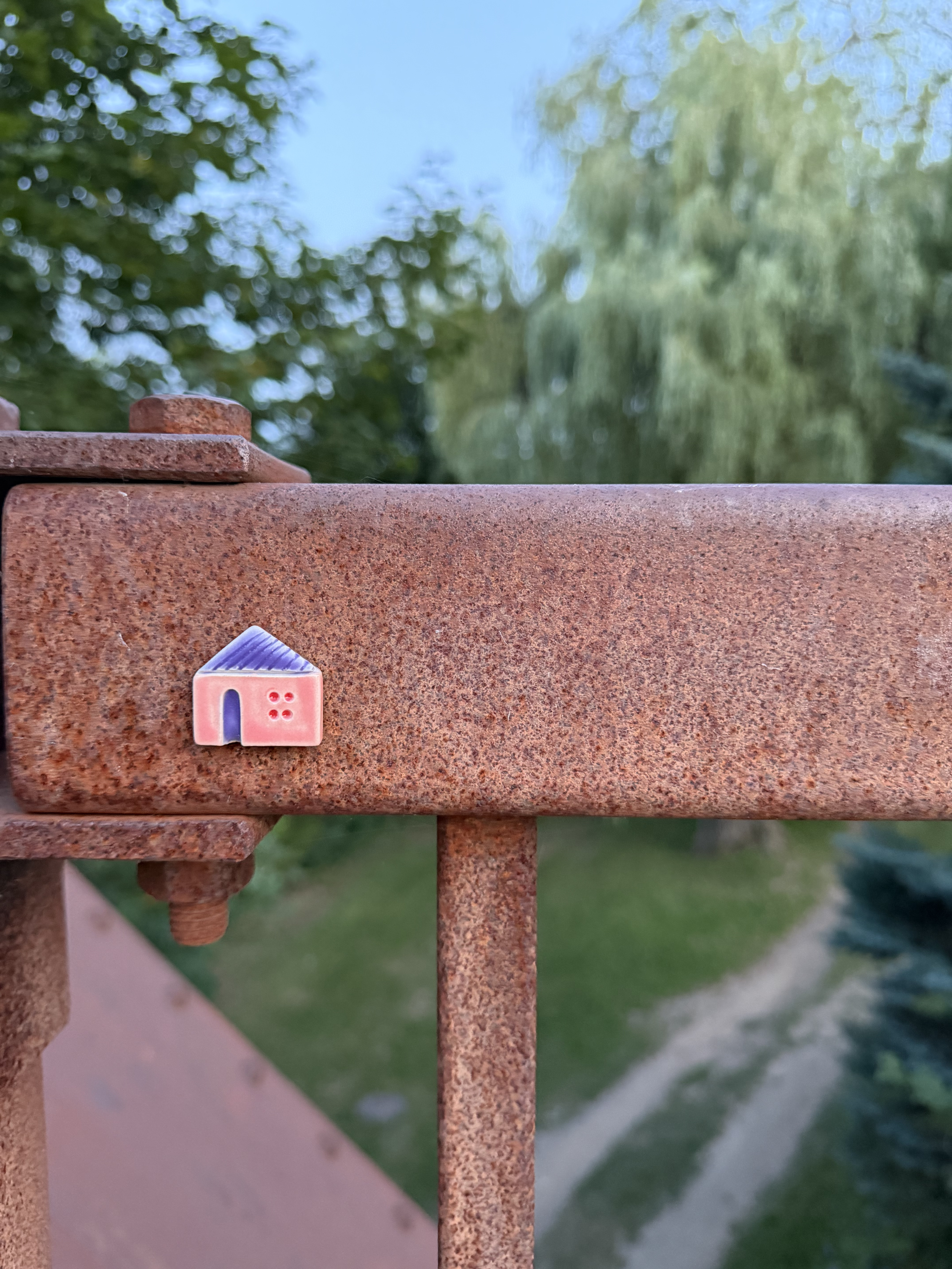 A ceramic house placed outdoors